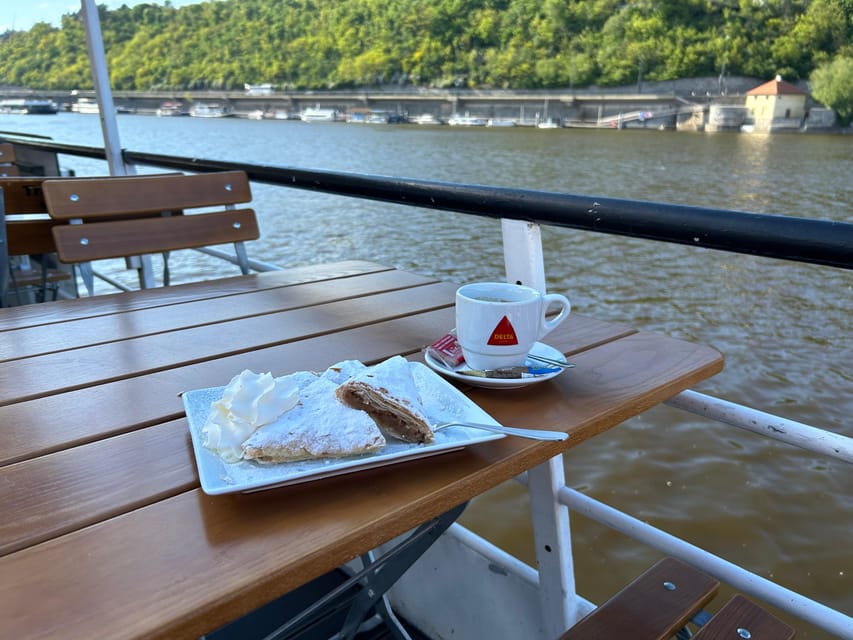 1 hour boat cruise with fragrant coffee and homemade strudel - The views: Charles Bridge arches first, then Prague Castle’s big scale