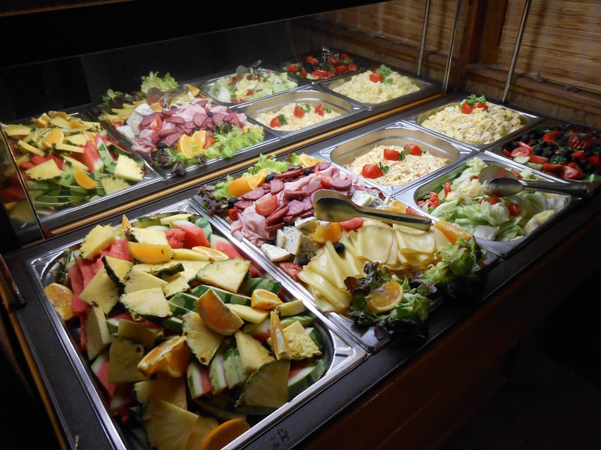 Prague: 1-hour Cruise with Audio Guide - Onboard comfort: drinks, warmth, and where photos make sense