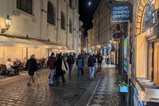 Prague by Night A Scenic Walk from Petrin Hill to Old Town - Old Town architectural “story stops”: Golden Well and the House of Ross