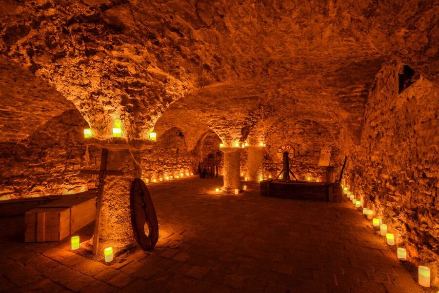 Prague: Ghosts, Legends, Medieval Underground & Dungeon Tour - Enter the Medieval Underground: Prague under Prague