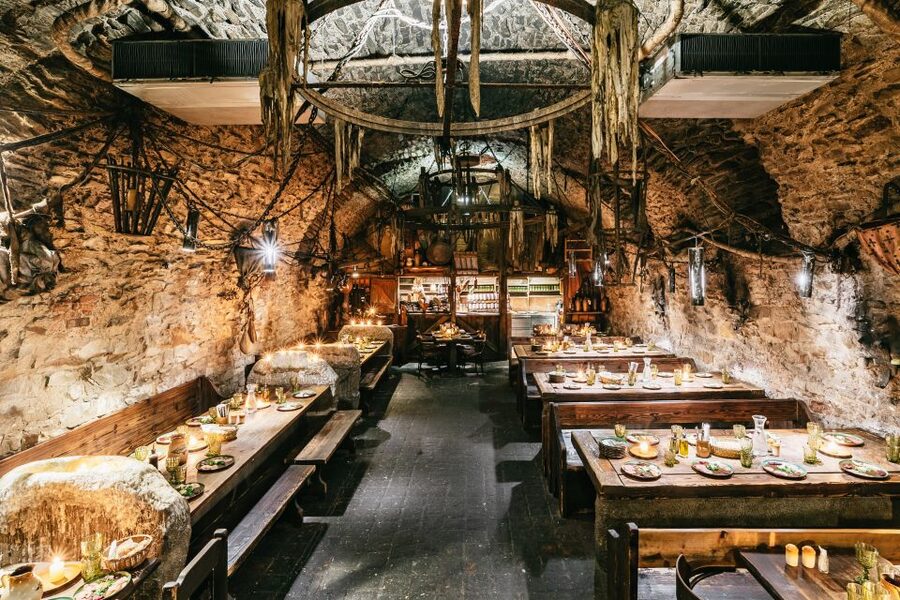 Prague: Medieval Dinner with Unlimited Drinks - Entering U Pavouka: a tavern setting built for a show